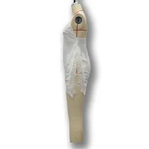 Side view of white satin camisole with intricate floral lace trim on mannequin torso