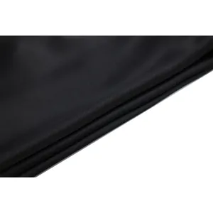 Macro detail of high-quality soft black fabric texture for a sexy lace camisole top