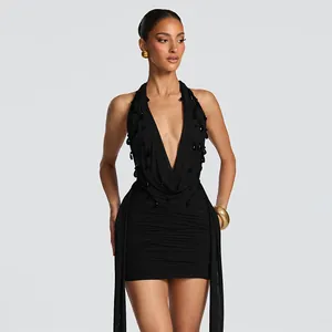 Detailed view of sexy black halter mini dress with teardrop beads and side sashes