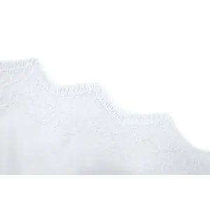 Detailed macro view showing the delicate white eyelash lace trim on a summer camisole