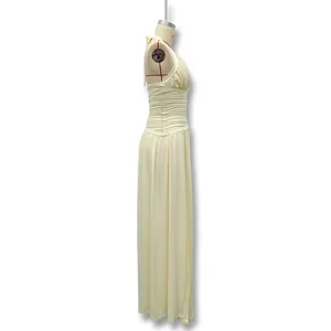 Side view of an elegant cream halter neck dress with ruched bodice and side slit detail