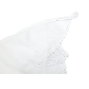 Close-up view showing the intricate white lace trim detail on a sexy strappy camisole top