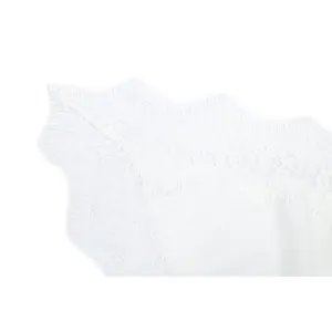Macro view showing the intricate white eyelash lace trimming of a summer camisole