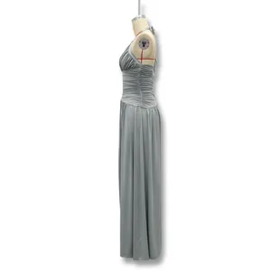 Side view of elegant grey halter neck backless maxi dress with ruched details on mannequin