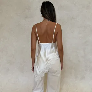 Detail showing back view of white satin camisole with lace trim and open back design