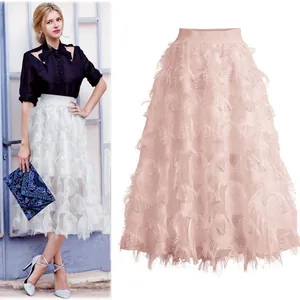 Close-up detail of a pink feathered leaf hollow midi skirt and white version on a model