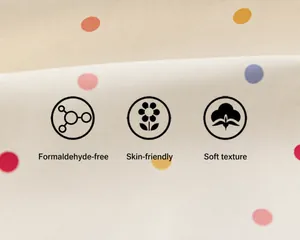 Close-up detail of soft and skin-friendly polka dot fabric for children's outdoor jacket