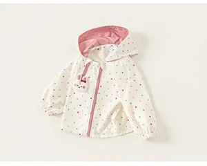 Girl's colorful polka dot hooded windbreaker with cute rabbit applique detail