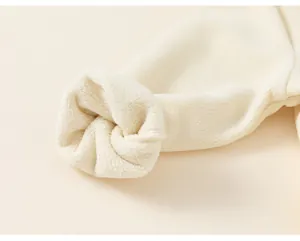 Close-up of soft fleece lining and cuff detail on kids windbreaker jacket