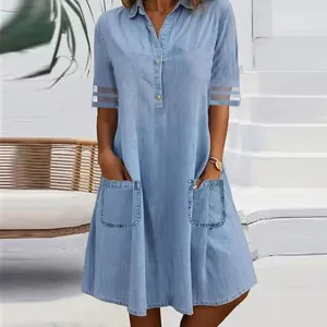Light blue denim shirt dress featuring mesh sleeve details and practical front pockets