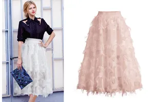 Close-up detail of the pink leaf hollow texture on this high waist A-line midi skirt