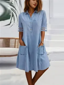 Stylish light blue washed denim shirt dress with mesh sleeves and convenient pockets for women