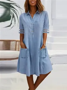 Casual light blue denim shirt dress with mesh stripes on short sleeves and front pockets