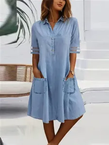 Stylish light blue denim washed shirt dress with mesh sleeves and front pockets for women.