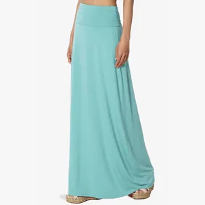 Full view of turquoise high waist maxi skirt showing soft drape and fit