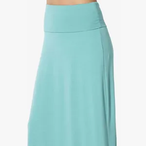 Close-up detail of a high-waisted teal maxi skirt focusing on its soft jersey fabric