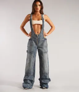 Full-body view of women's wide-leg denim overalls with front zipper and large pockets