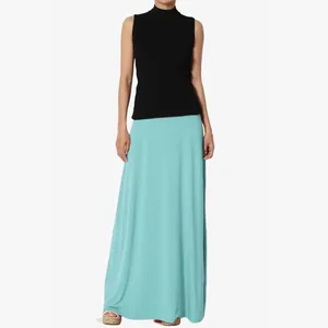Full view of high-waisted mint green maxi skirt on model for a casual elegant look