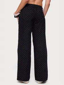 Jean noir élégant à taille haute et jambes larges avec motif à pois blancs, vue de l'arrière