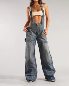 Detailed shot showing the zip-front design and wide-leg cut of these denim overalls