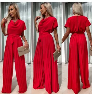 Detailed three-angle view of a vibrant red pleated wide-leg jumpsuit with belt.
