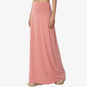 Full-length view of a women's high-waisted pink jersey maxi skirt on model