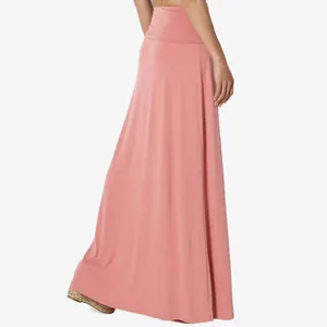 Detailed view of a dusty pink high-waisted maxi skirt featuring soft jersey fabric drape