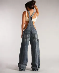 Detail view showing the back of baggy denim overalls with wide legs and pockets.