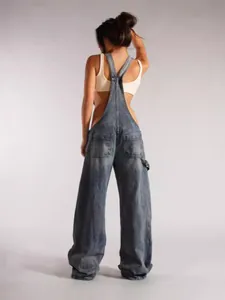 Women's relaxed fit denim overalls featuring back pocket detail in a vintage washed finish