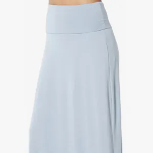 Close-up of high-waisted maxi skirt showing soft elastic fabric and wide waistband