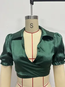 Emerald green satin puff sleeve cropped top detail with elegant lapel collar design