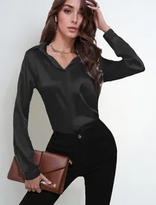 Detail view of a black satin long-sleeve shirt featuring an elegant commuter style.