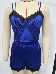 Detailed view of royal blue satin camisole set with delicate black lace trim on a mannequin