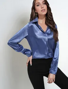Elegant blue satin long-sleeved shirt for women, showing silky texture and fit on model