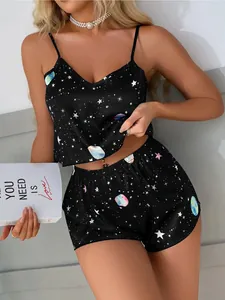 Close-up of galaxy print satin camisole and shorts pajama set for women home wear