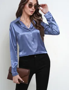 Detail view of a blue satin long-sleeve shirt for women with elegant silky texture