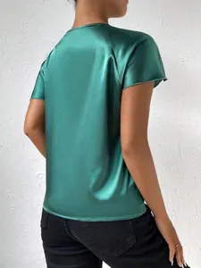 Back view of a green satin short sleeve top showing the smooth texture and luster