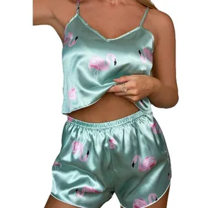 Satin two-piece pajama set for women featuring pink flamingo print on light green fabric
