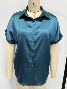 Close-up front view of a teal satin short sleeve button-up casual shirt on mannequin stand