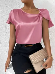 Detail of pink satin blouse showing the shoulder knot design and silky fabric texture