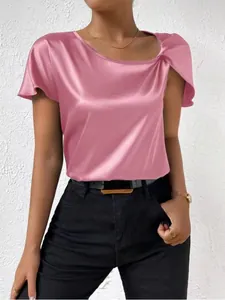 Close-up detail of a pink satin short sleeve blouse with elegant twist shoulder design