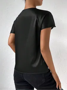 Detailed back view of a minimalist black satin short sleeve blouse with a smooth silky texture