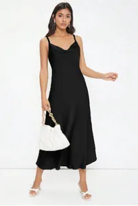 Elegant black satin cowl neck midi dress with thin spaghetti straps shown on model