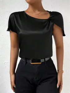 Detail view showing the elegant shoulder knot on a black satin short-sleeve blouse