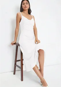 Elegant close-up view of a white satin cowl neck camisole midi dress worn by a model