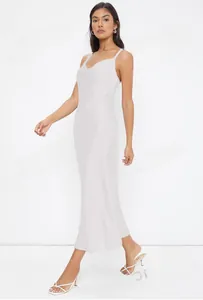 Elegant full-length white satin slip dress with a cowl neck on a professional model
