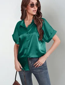 Detail view of emerald green satin short-sleeve button-down shirt for women