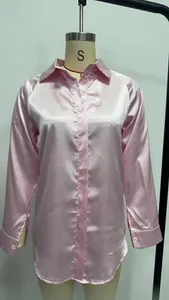 Elegantly tailored pink long sleeve satin shirt with a smooth silky finish on display