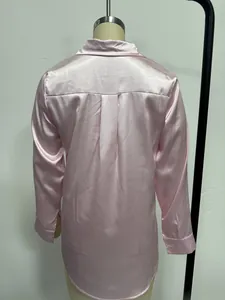 Detailed back view of a pink satin long sleeve shirt on a clothing mannequin stand