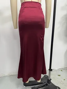 Detailed rear view of a burgundy satin fishtail maxi skirt on a mannequin